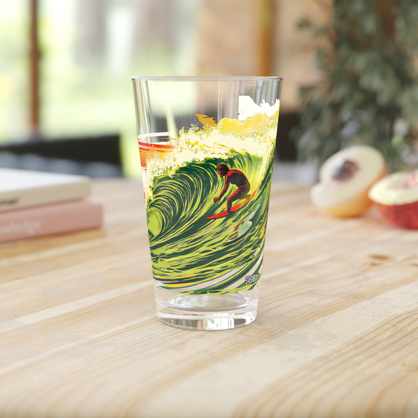 Ride the Hawaiian wave of style with our Surfing Wave Art Pint Glass. Exclusively produced by Stashbox.ai, this 16oz glass boasts striking green, yellow, and red waves, bringing the Aloha spirit to your drinkware collection. Cheers to tropical vibes!