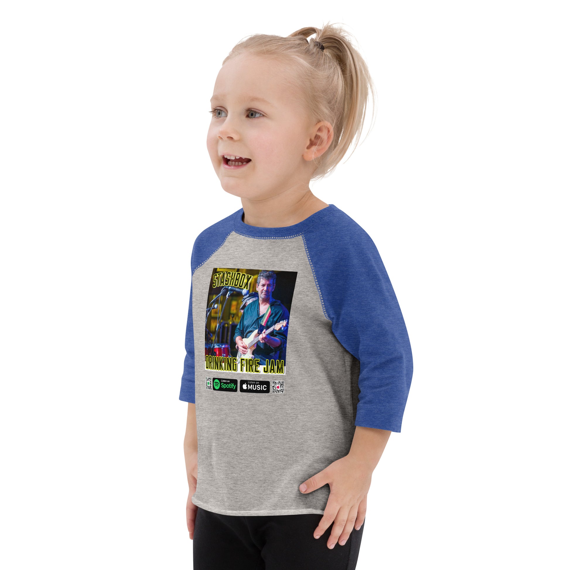 Dress your little rockstar in style with our Drinking Fire Toddler Baseball Shirt. Stashbox Design #004. Your fashion, your groove, exclusively at Stashbox.ai.